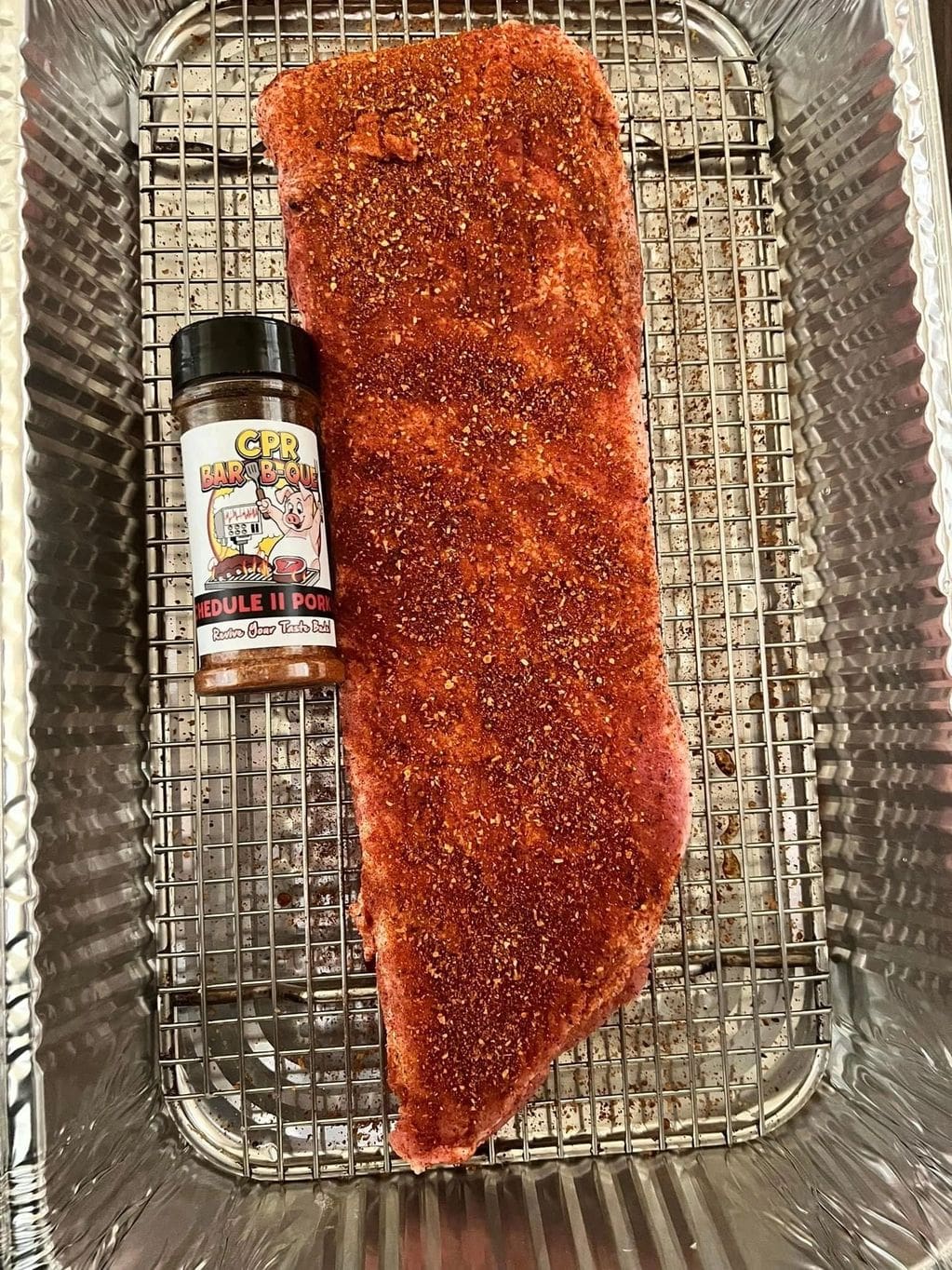 A piece of meat sitting on top of a grill.