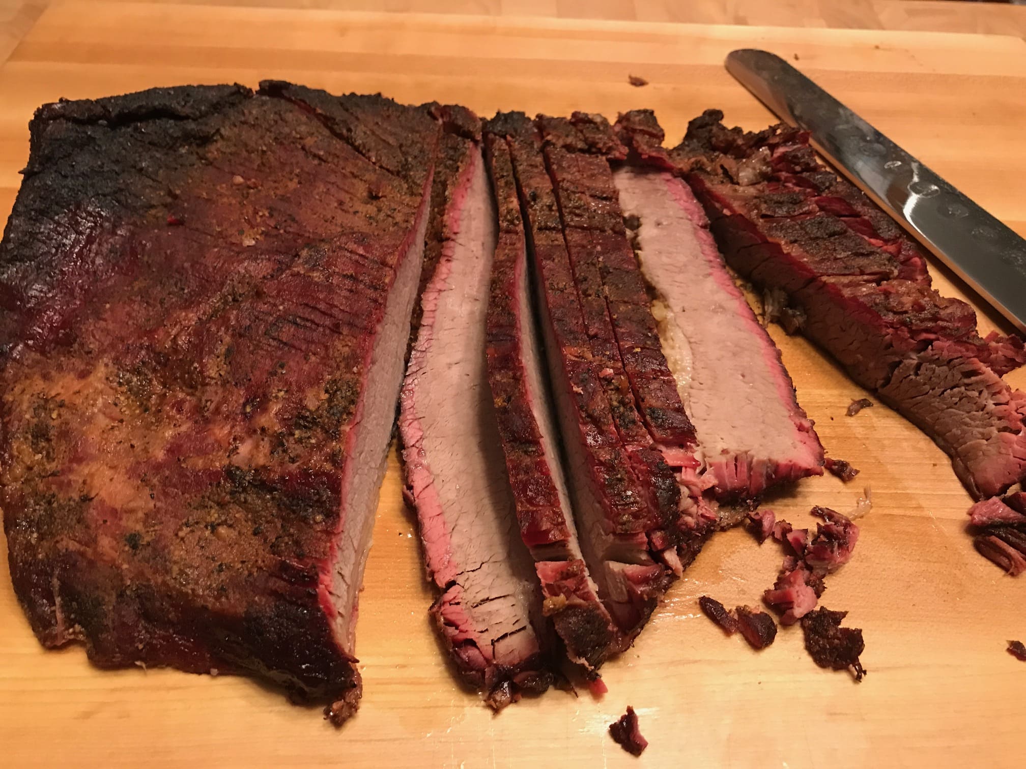 A cutting board with some meat on it