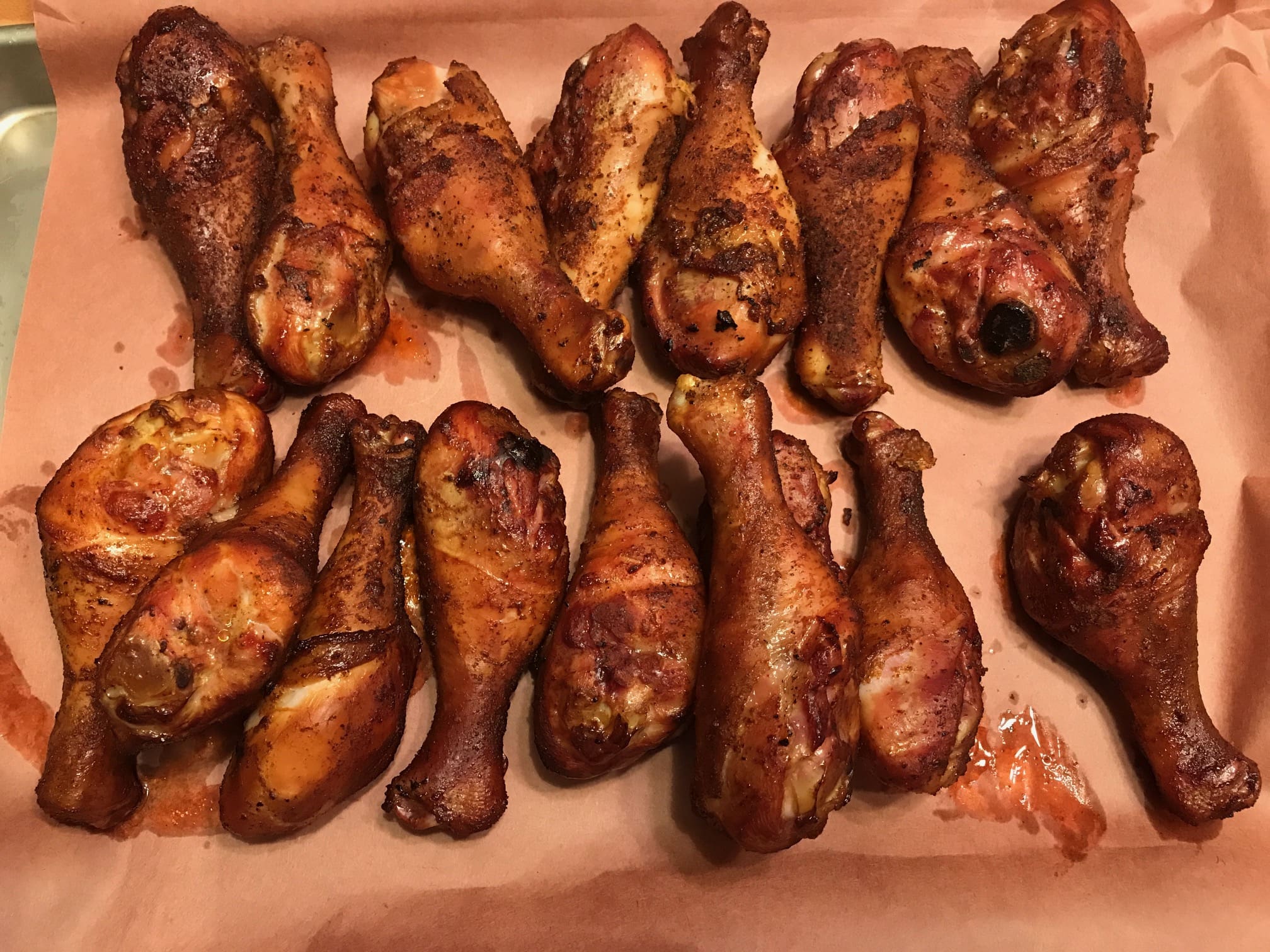A bunch of chicken legs are on the table