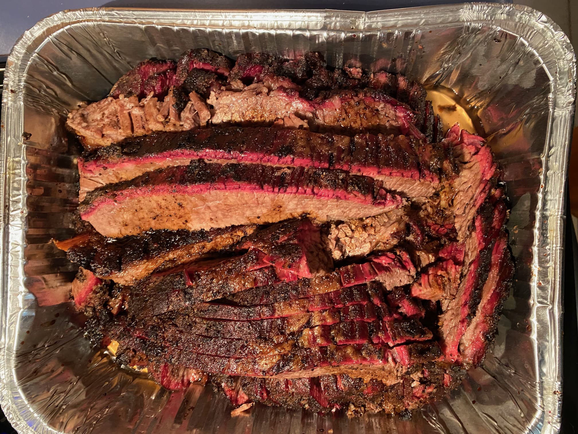 A close up of some meat in a pan