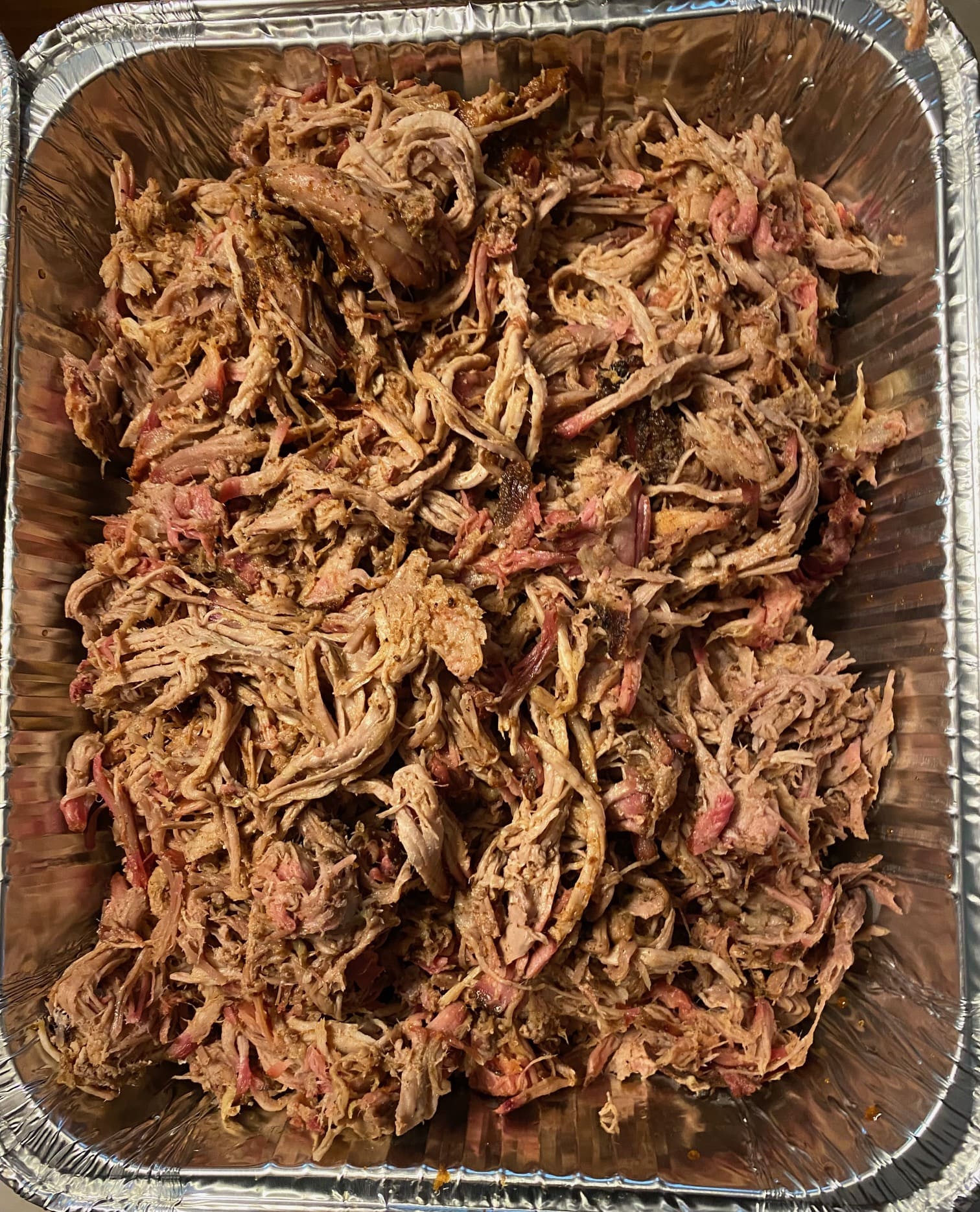 A close up of a tray with pulled pork